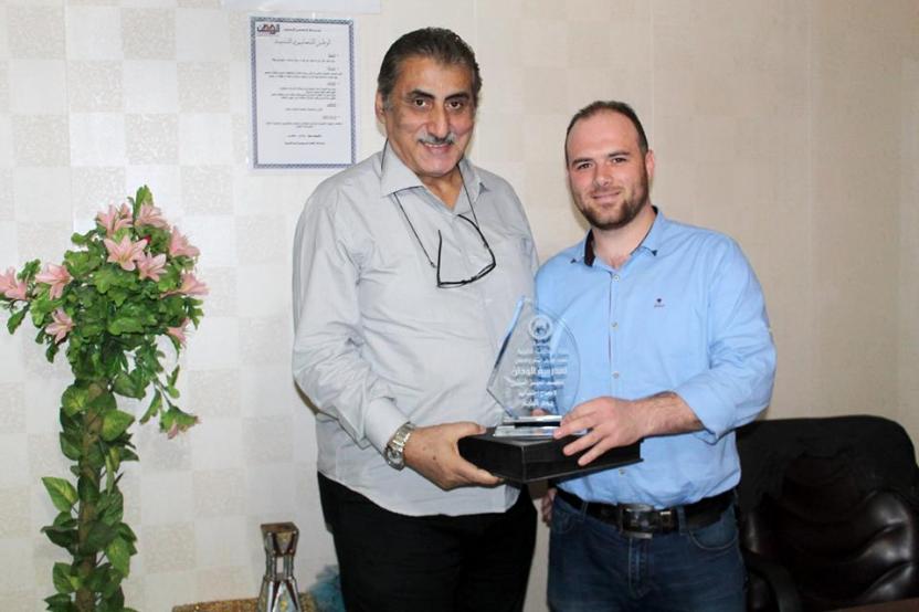 Hamza al-Khatib Foundation handed over the shield to Mr. Amir Shahla